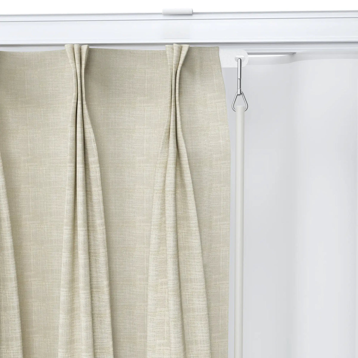 Beige textured fabric curtain with prominent vertical pleats, suspended from a modern white track system, featuring a polished silver metallic pull rod handle in an interior setting