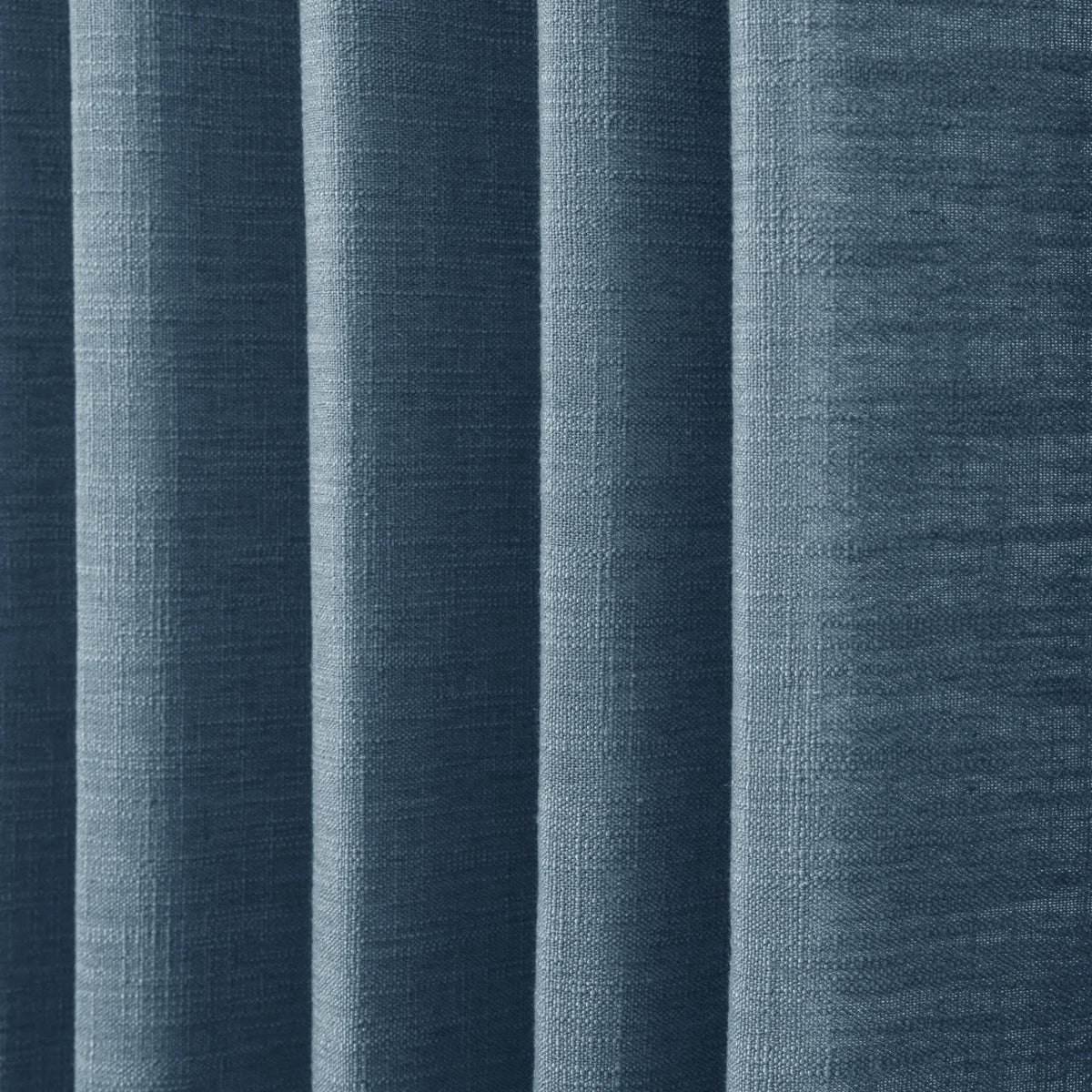 Aegean Blue Liz linen curtains in a close room detail highlighting the linen texture and colour