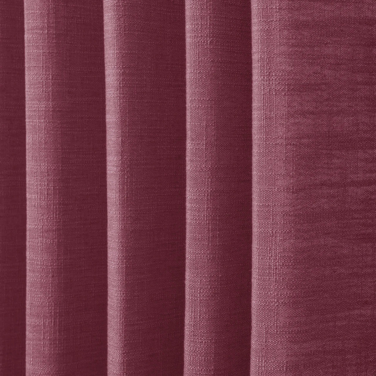 Burgundy Red Liz linen curtains in a close room detail highlighting the linen texture and colour
