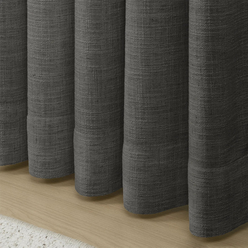 Carbon Grey Liz linen curtains showing the lower drape and pooling folds near the floor