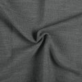 Carbon Grey Liz linen curtains drawn partly across the window with filtered light revealing the weave