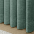 Everglade Teal Liz linen curtains showing the lower drape and pooling folds near the floor