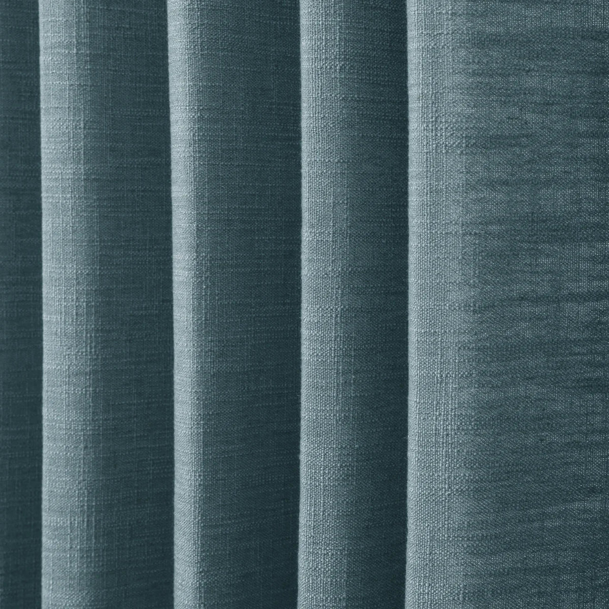 Everglade Teal Liz linen curtains in a close room detail highlighting the linen texture and colour