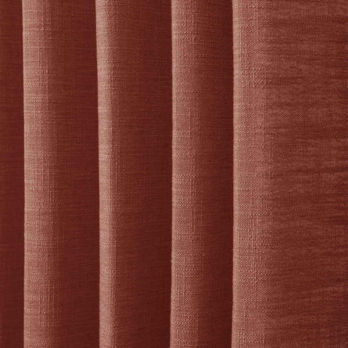 Firebrick Liz linen curtains in a close room detail highlighting the linen texture and colour