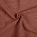 Firebrick Liz linen curtains drawn partly across the window with filtered light revealing the weave
