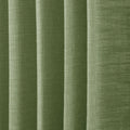 Green Liz linen curtains in a close room detail highlighting the linen texture and colour