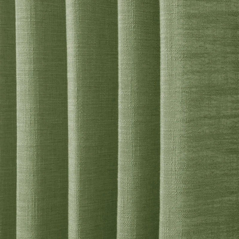 Green Liz linen curtains in a close room detail highlighting the linen texture and colour