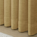 Khaki Liz linen curtains showing the lower drape and pooling folds near the floor