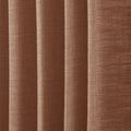 Orange Copper Liz linen curtains in a wider lifestyle scene with furnishings and softly flowing folds