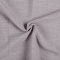 Parchment Liz linen curtains drawn partly across the window with filtered light revealing the weave