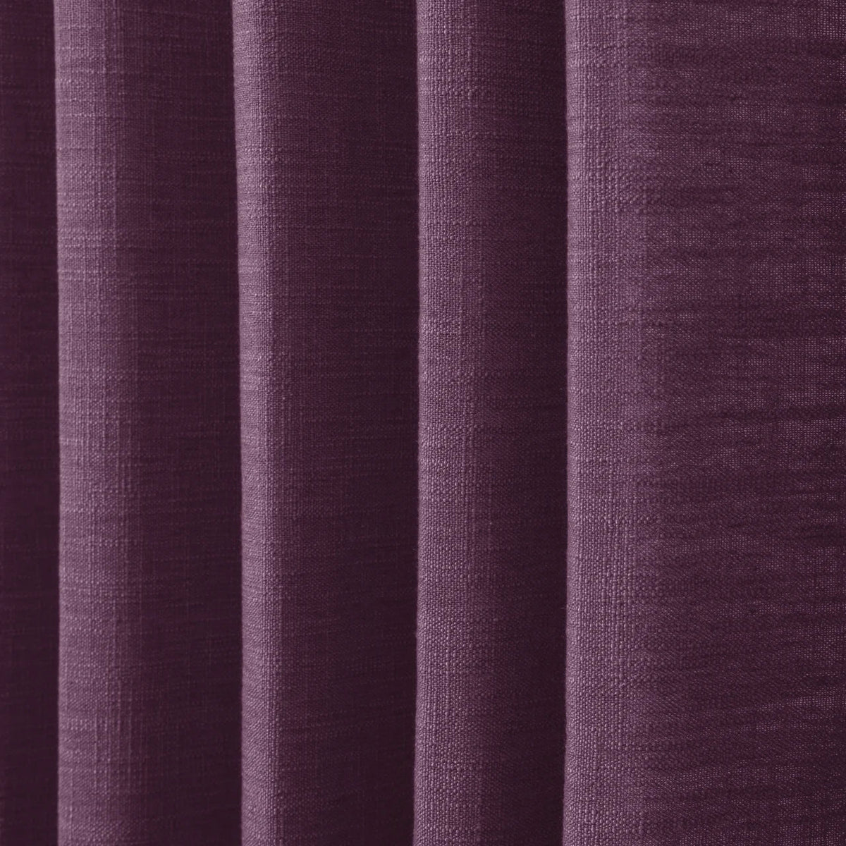 Plum Liz linen curtains in a close room detail highlighting the linen texture and colour