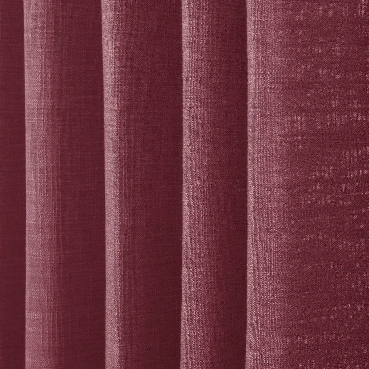 Red Wine Liz linen curtains in a close room detail highlighting the linen texture and colour