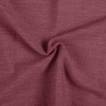 Red Wine Liz linen curtains drawn partly across the window with filtered light revealing the weave