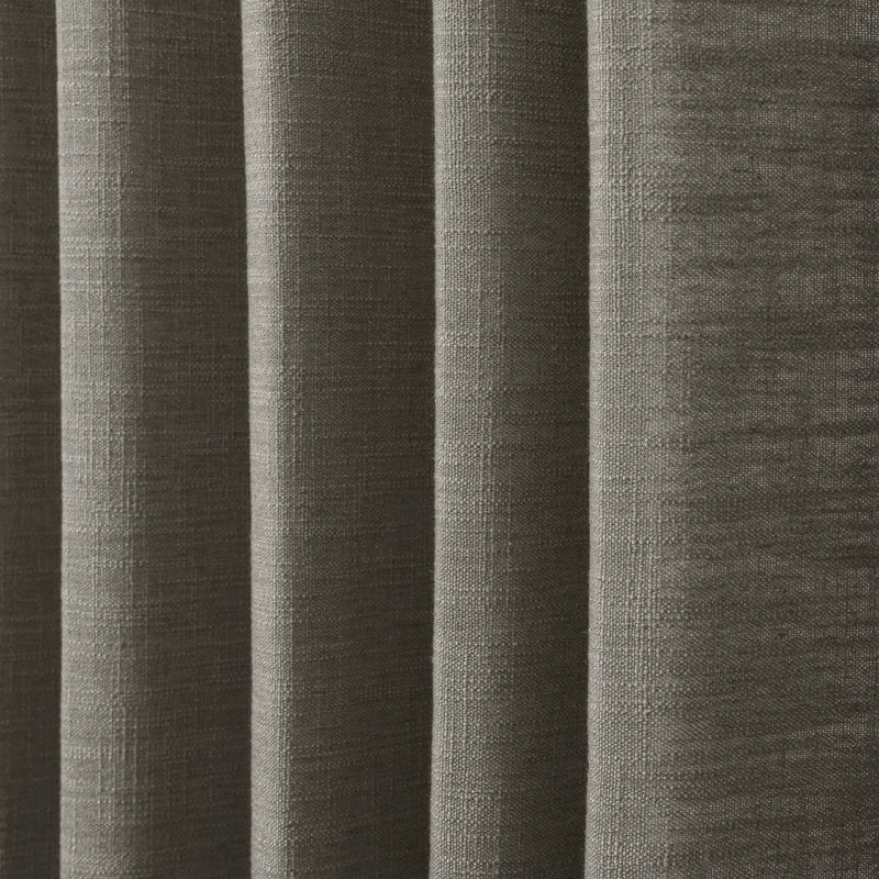 Sepia Ebony Liz linen curtains in a wider lifestyle scene with furnishings and softly flowing folds