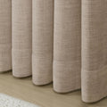 Tapioca Liz Linen Pleated Curtains rounded curtain hems above a pale wood floor