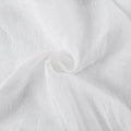 Joy Pure Linen Pleated Voile Curtains - White pure linen voile fabric twisted into a soft spiral close-up
